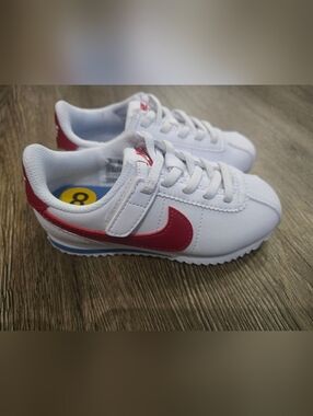 Nike Kids White Sneakers with Red Swoosh